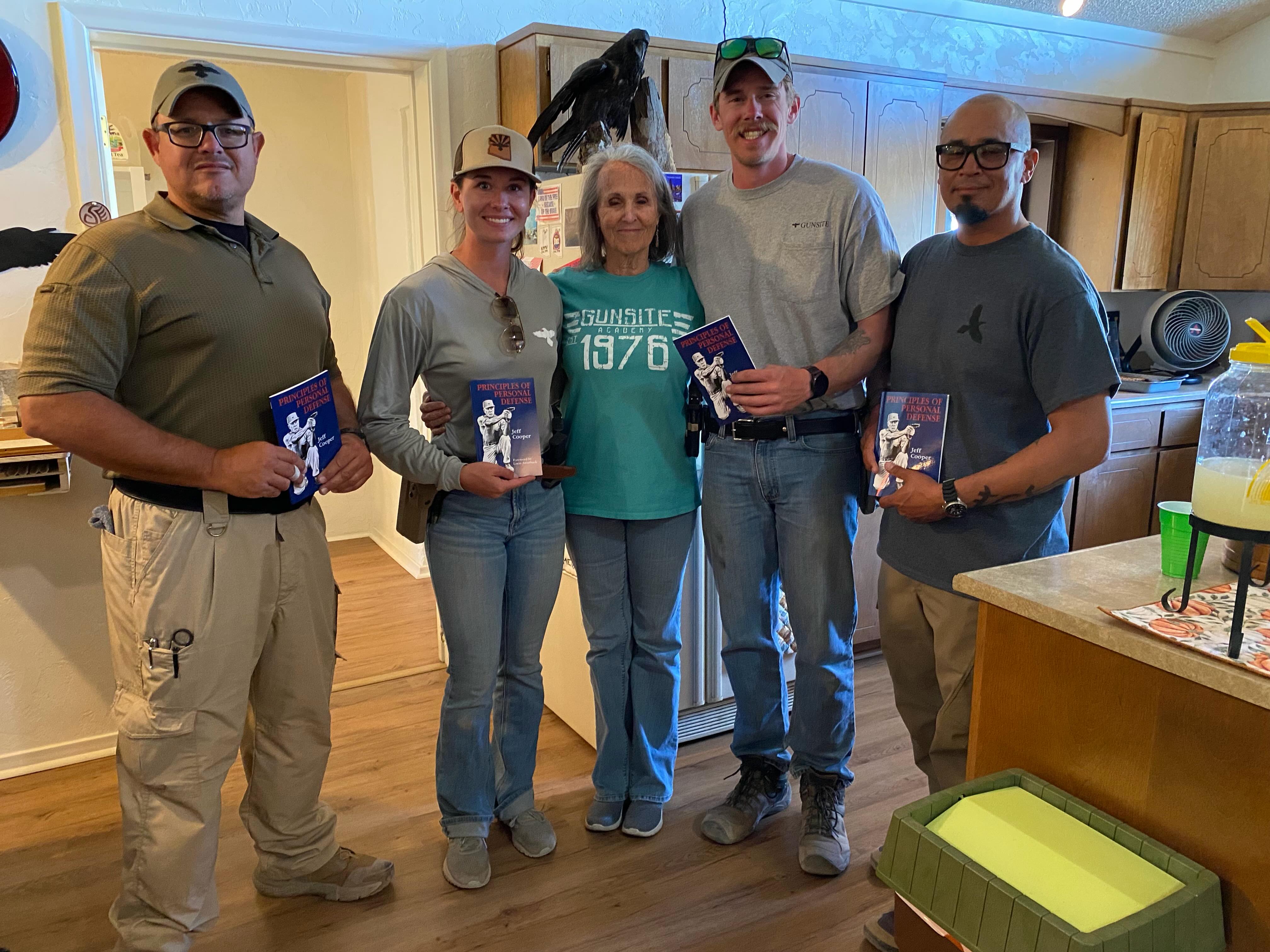 Our latest scholarship recipients at Gunsite, May 29, 2026. Carlos Roman (E ticket), 
Anna Componovo (second in the shootoff),
Lindy, Trevor Coningham (won the shootoff), and Chris Rabago. Outstanding!