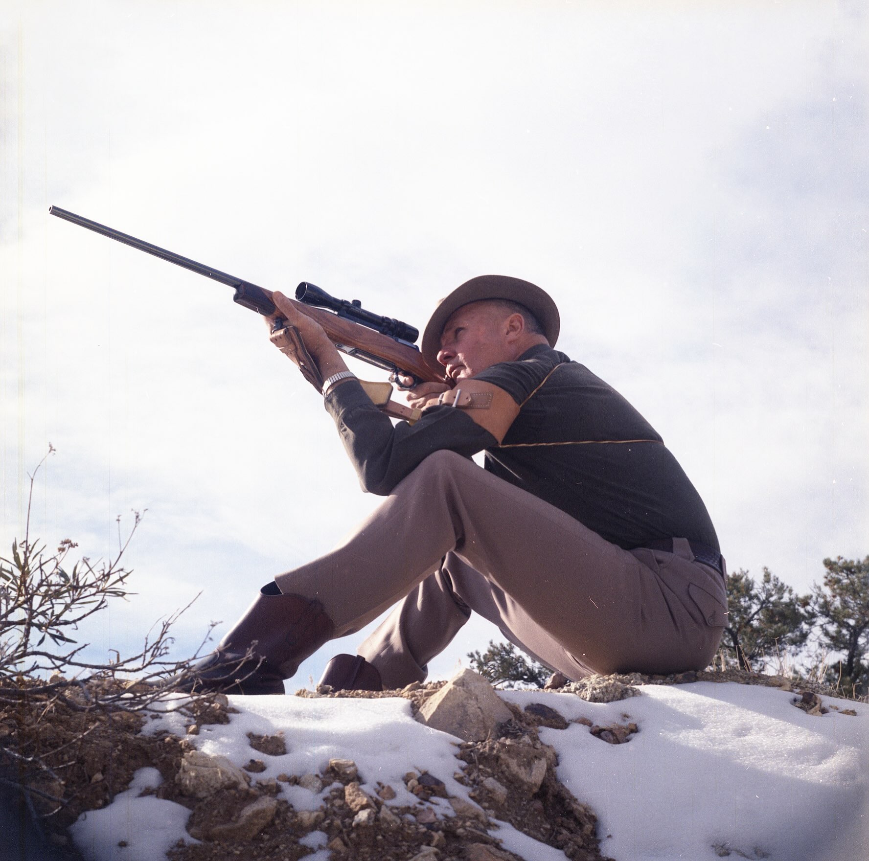 Jeff with his first Big Game rifle, A Remington M30S in 30-06 acquired when he was 16.  It was re-stocked and re-furbished, probably in the 60’s.  Here he is using a target sling and conventionally-mounted scope.  He had not yet developed the Scout Rifle and CW Sling concept.
